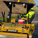 A John R. Jurgensen asphalt paving roller operator works on paving of the Southern Ohio Veteran's Memorial Highway in Portsmouth, Ohio in the Fall of 2017.